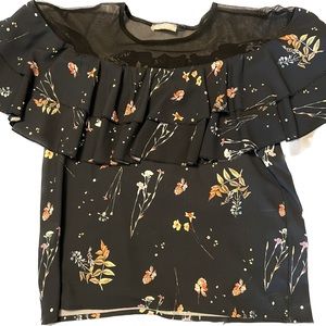 Blouse with sheer neckline